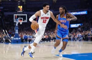 Apr 2, 2025; Oklahoma City, Oklahoma, USA; Detroit Pistons forward Tobias Harris (12) drives around Oklahoma City Thunder guard Cason Wallace (22) during the second quarter at Paycom Center. Mandatory Credit: Alonzo Adams-Imagn Images